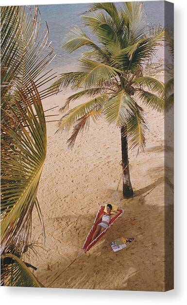 Caribe Hilton Beach #1 Canvas Art Print by Slim Aarons
