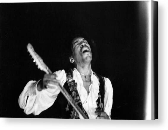 Jimi Hendrix Performs At Monterey #1 Canvas Art Print by Michael Ochs Archives