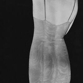 A Negative Print Of A Woman Wearing A Corset by George Hoyningen-Huene