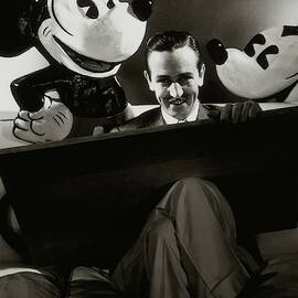 A Portrait Of Walt Disney With Mickey And Minnie by Edward Steichen