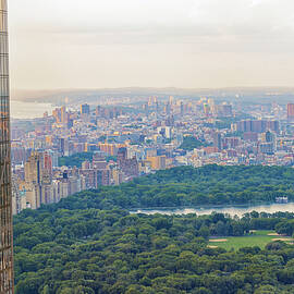 A sprawling metropolitan skyline is visible from above by Manjik Pictures