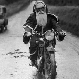 Cycling Santa by Fox Photos