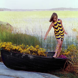 Model in Rowboat Filled with Yellow Flowers by Gordon Parks