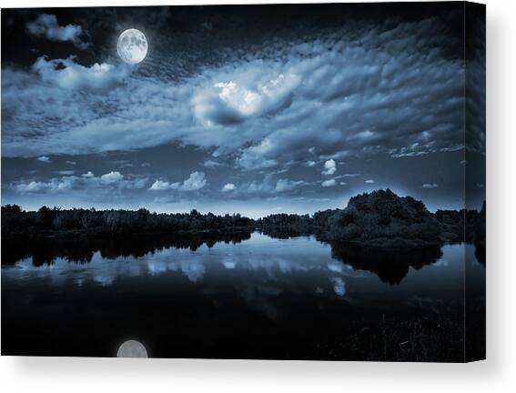 Moonlight over a lake Canvas Art Print by Jaroslaw Grudzinski