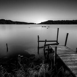 Old Pier After Sunset in Black and White by Nicklas Gustafsson
