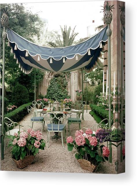 Outdoor Furniture On A Terrace Canvas Art Print by Tom Leonard