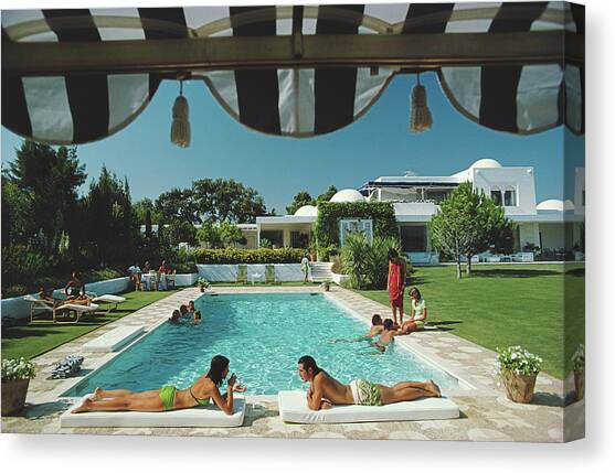 Poolside In Sotogrande Canvas Art Print by Slim Aarons