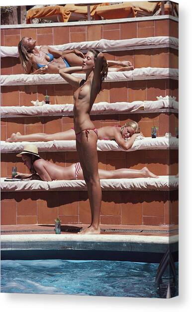 Sunbathing On Capri Canvas Art Print by Slim Aarons