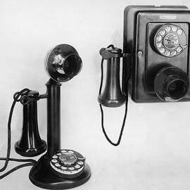 Two Old-fashioned Telephones by Authenticated News