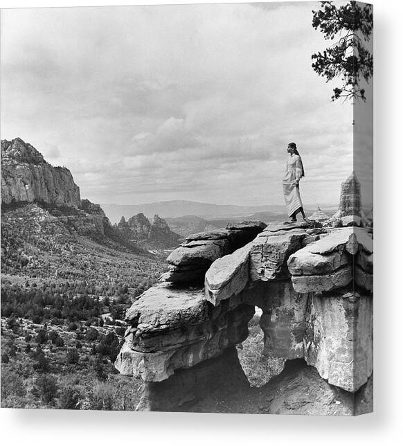 Veruschka on a Barren Cliff in the Arizona Desert Canvas Art Print by Franco Rubartelli
